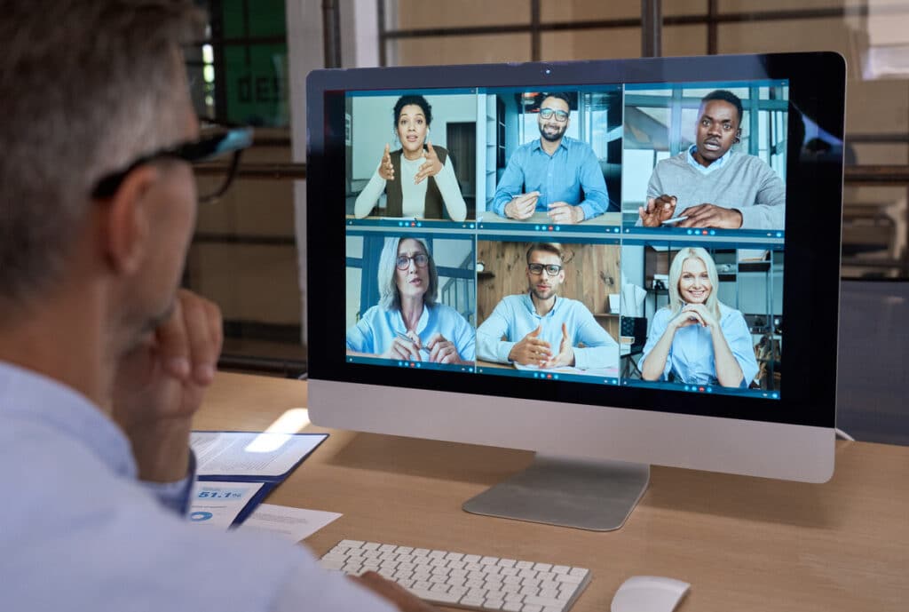 man using virtual meeting on desktop