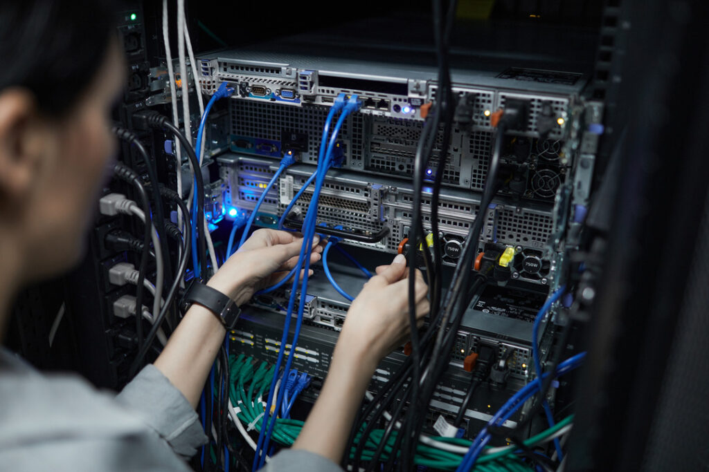 Woman works on data cable installation