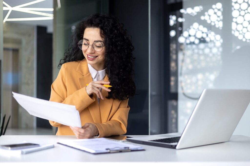 business woman working on computer in office using it support services