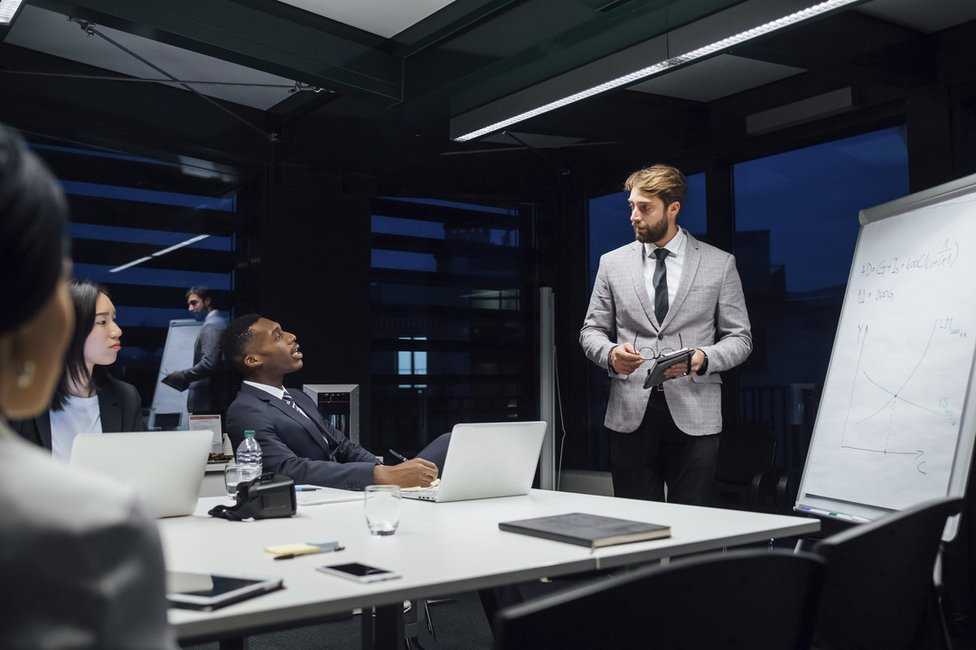 Employees in a conference room learn how to prevent insider threats
