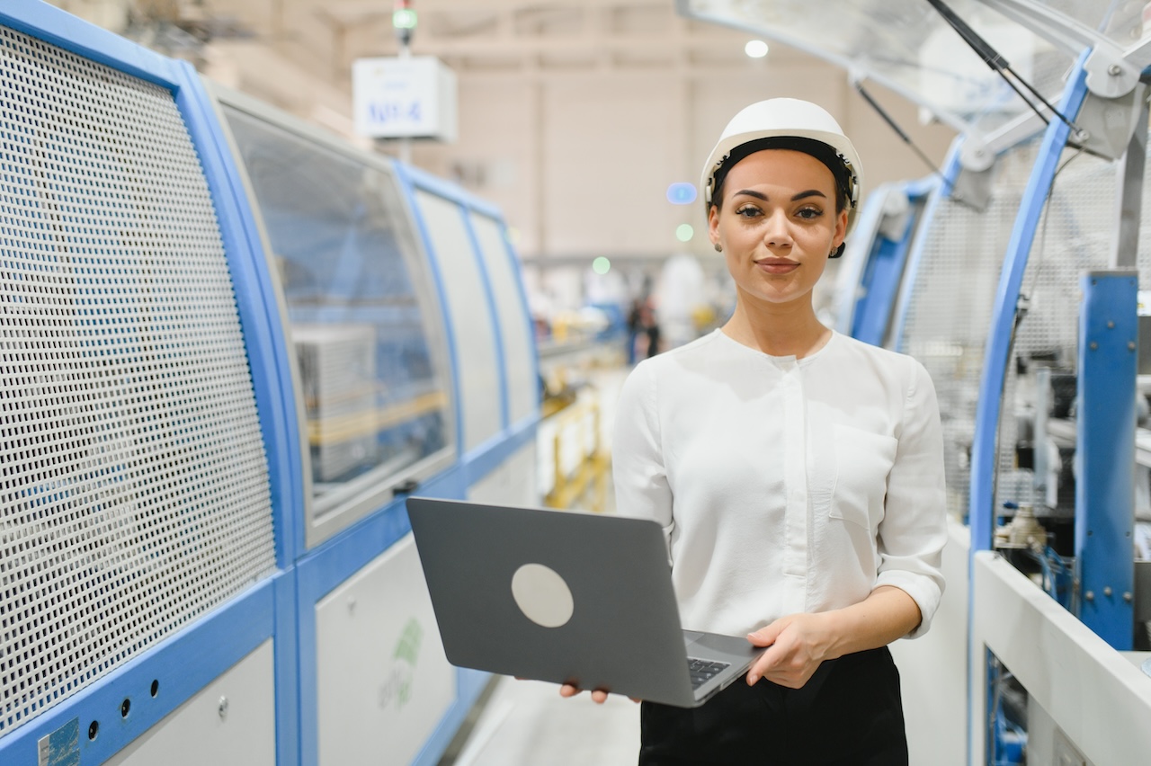 female tech supervising manufacturing IT support